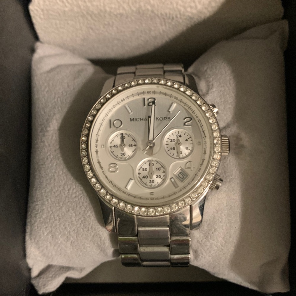 Michael Kors silver oversized watch with rhinestones.